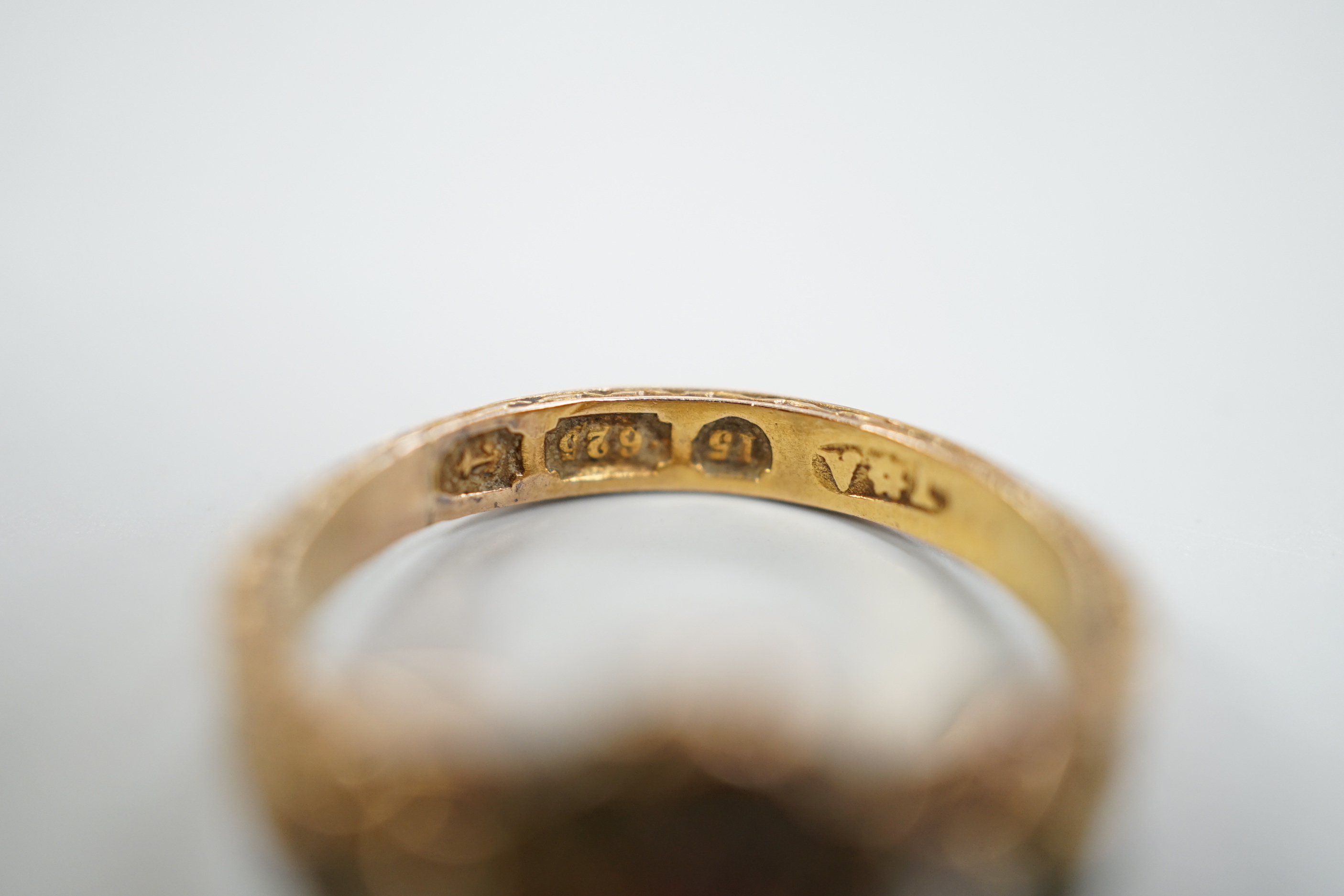 A late Victorian 15ct gold, ruby?, emerald and seed pearl cluster set dress ring, size K, gross weight 2.6 grams, with engraved shank.